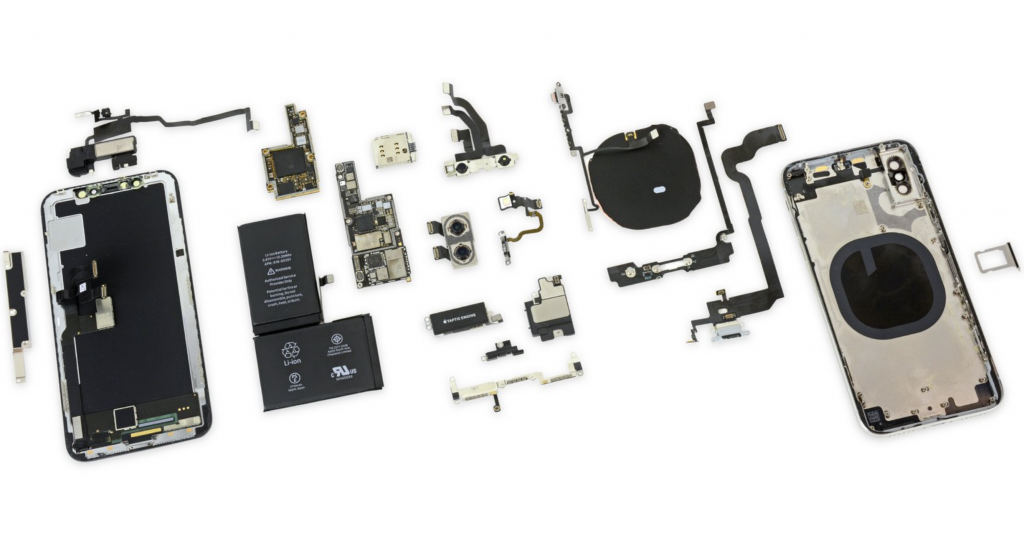 A photo showing all the parts of an iPhone X after disassembled
